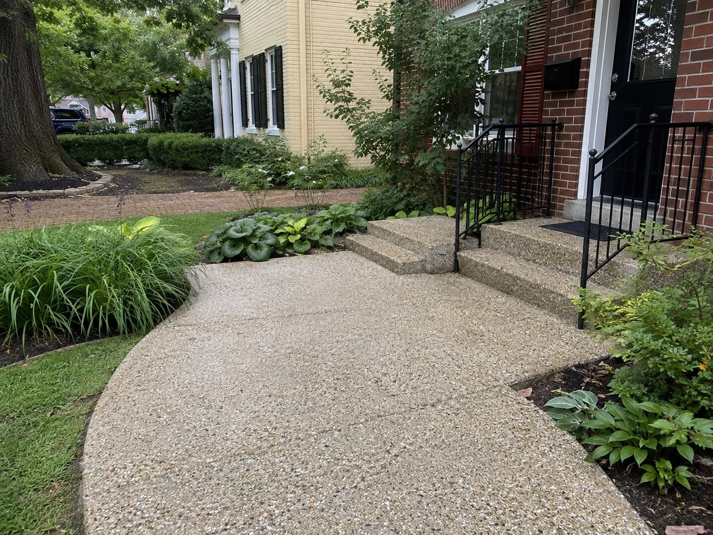 Exposed aggregate concrete walkway and front steps leading to a Washington DC entrance